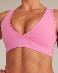 Woman wearing Stamina Sports Bra - Candy Pink | Set:true | Angle:closeup | Size:S