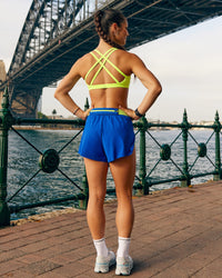 Woman wearing Velocity Sports Bra - Lime Glo | Model:Jasynta | Size:S