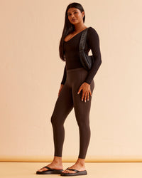 Woman wearing Vitality Long Sleeve Top - Black | Model:Nikki | Size:S