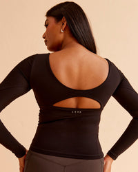 Woman wearing Vitality Long Sleeve Top - Black | Model:Nikki | Size:S