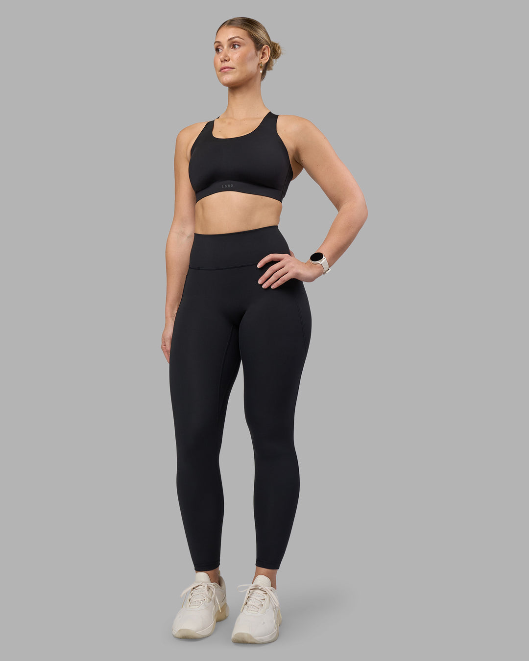 Woman wearing Stability Sports Bra - Black | Model:Amy | Size:S (D-E Cup)