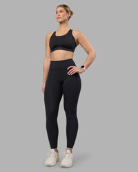 Woman wearing Stability Sports Bra - Black | Model:Amy | Size:S (D-E Cup) | Thumbnail Index: 8