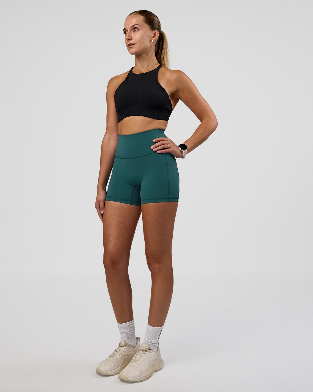 Woman wearing AMRAP High Neck Sports Bra - Black | Model:Myrte | Size:S - view 3