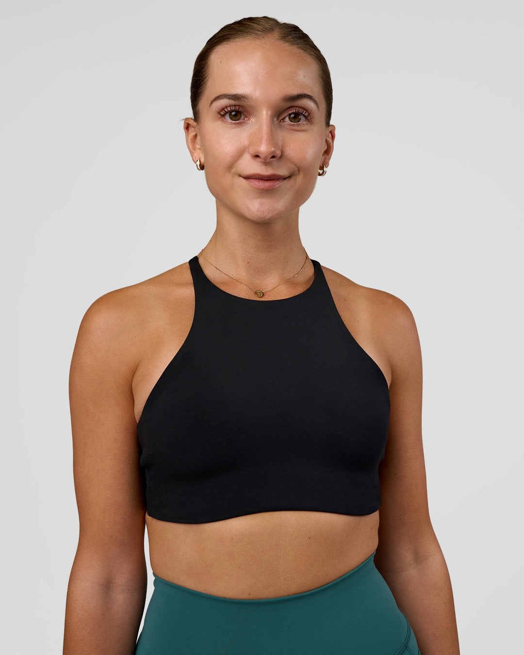 Woman wearing AMRAP High Neck Sports Bra - Black | Model:Myrte | Size:S - view 2