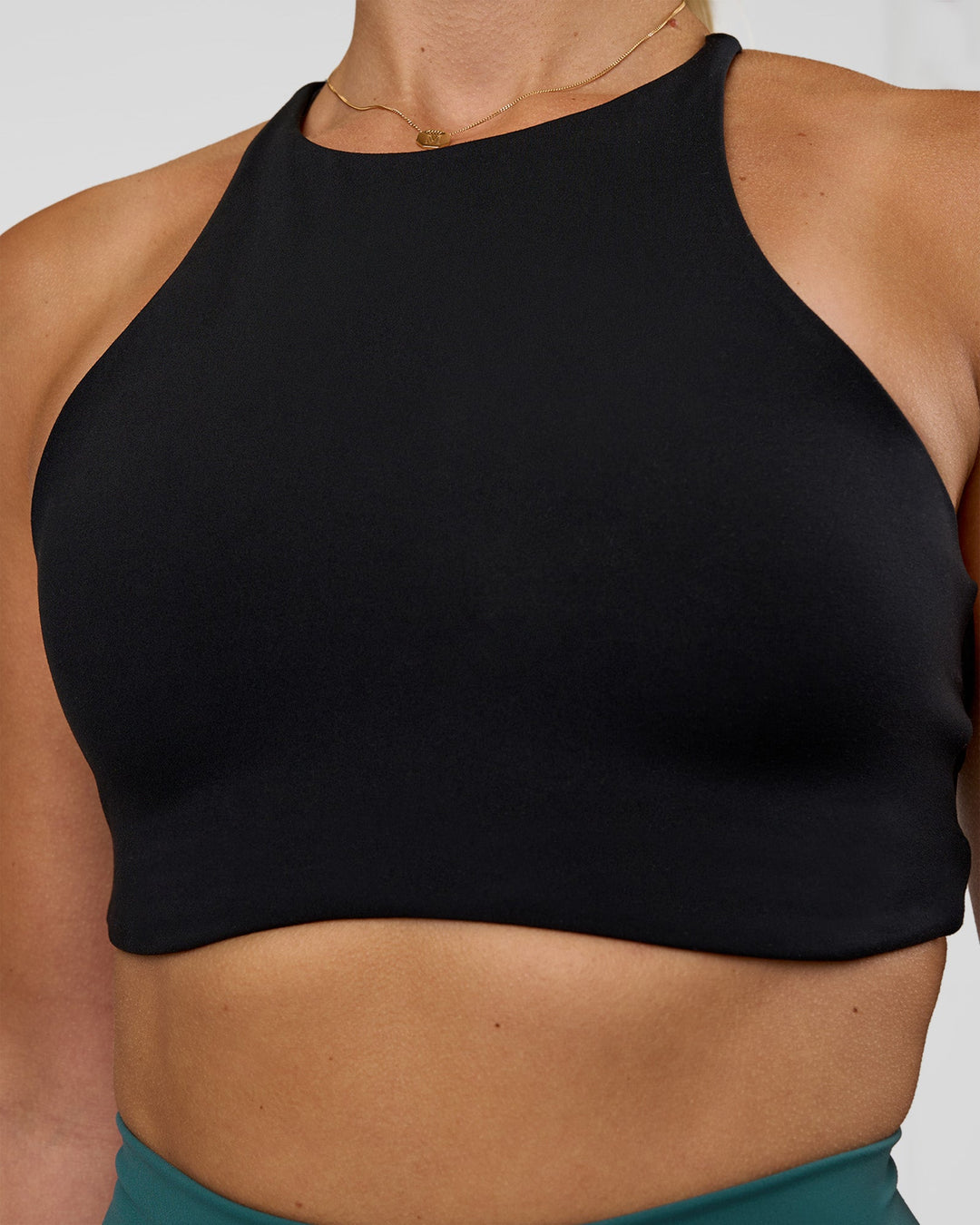 Woman wearing AMRAP High Neck Sports Bra - Black | Model:Myrte | Size:S - view 4