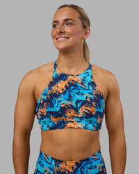 Woman wearing AMRAP High Neck Sports Bra - React Print | Model:Georgia | Size:S | Thumbnail Index: 0