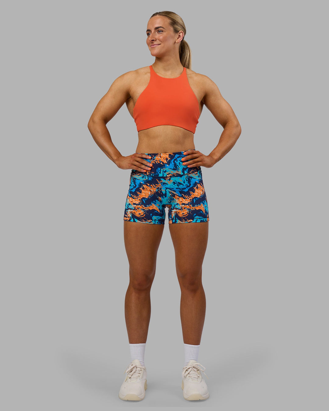 Woman wearing AMRAP High Neck Sports Bra - Ultra Orange | Model:Georgia | Size:S