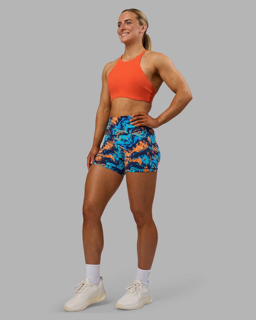 Woman wearing AMRAP High Neck Sports Bra - Ultra Orange | Model:Georgia | Size:S
