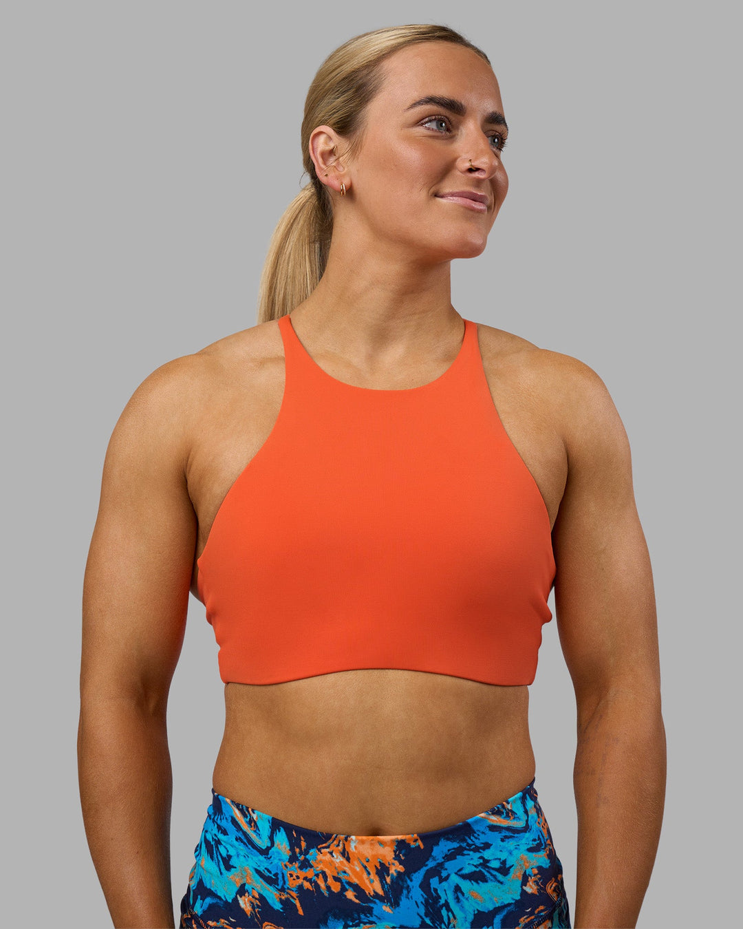 Woman wearing AMRAP High Neck Sports Bra - Ultra Orange | Model:Georgia | Size:S