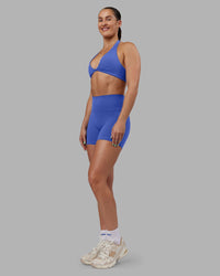 Woman wearing Abs Fusion High-Rise 4" Short Pockets - Power Cobalt | Model:Abbey | Size:S