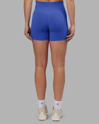 Woman wearing Abs Fusion High-Rise 4" Short Pockets - Power Cobalt | Model:Abbey | Size:S