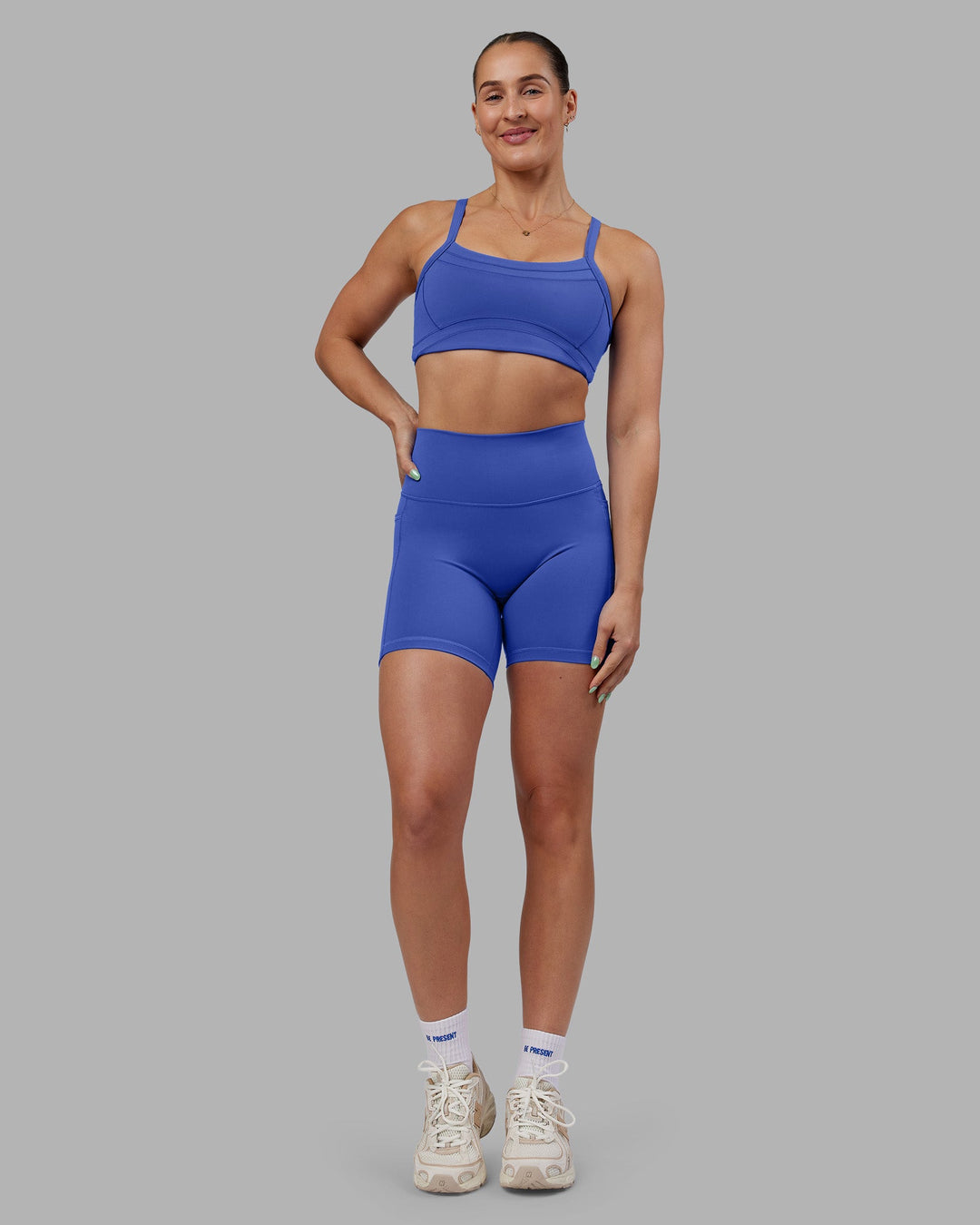 Woman wearing Abs Fusion High-Rise 6&quot; Short Pockets - Power Cobalt | Model:Abbey | Size:S