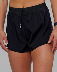 Woman wearing Accelerate 3" High-Rise Running Short - Black | Set:true | Angle:closeup | Model:Keisha | Size:S
