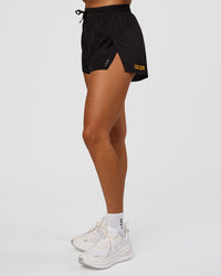 Woman wearing Accelerate 3" High-Rise Running Short - Black-Radiate | Model:Rosie | Size:S