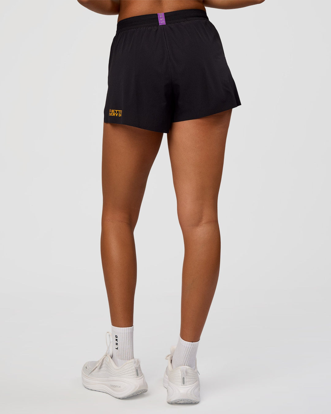 Woman wearing Accelerate 3" High-Rise Running Short - Black-Radiate | Model:Rosie | Size:S