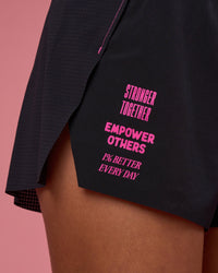 Woman wearing Accelerate 3" High-Rise Running Short - Black-Ultra Pink | Model:Hannah | Size:S