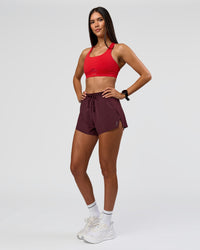 Woman wearing Accelerate 3" High-Rise Running Short - Cherry Lacquer | Model:Rhiley | Size:S | Thumbnail Index: 4
