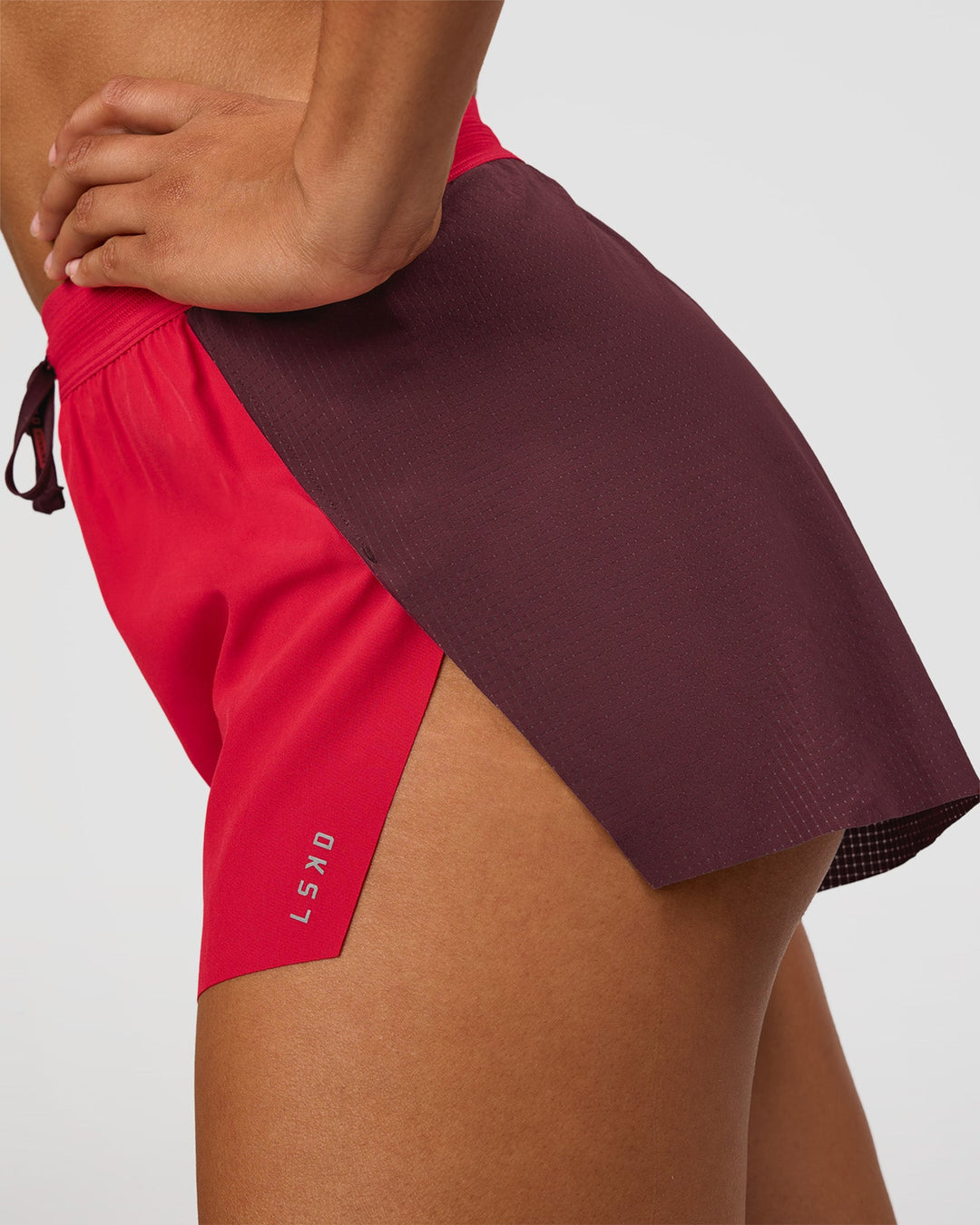Woman wearing Accelerate 3" High-Rise Running Short - Cherry Lacquer-Scarlet | Model:Rosie | Size:S | - view 3