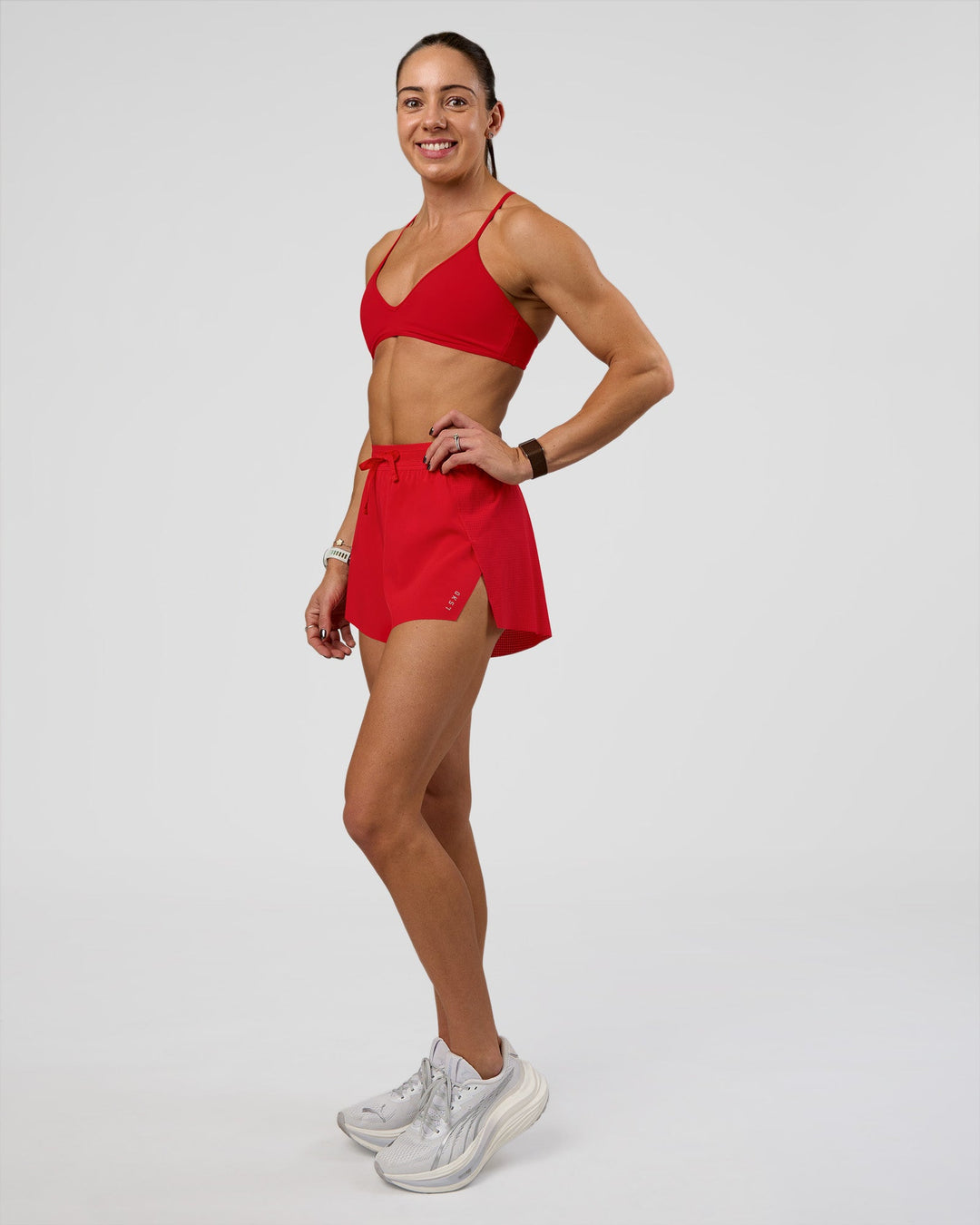 Woman wearing Accelerate 3" High-Rise Running Short - Flame | Model:Zara | Size:S