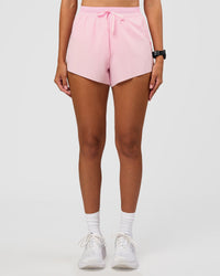 Woman wearing Accelerate 3" High-Rise Running Short - Marshmallow | Set:true | Angle:front | Model:Rhiley | Size:S