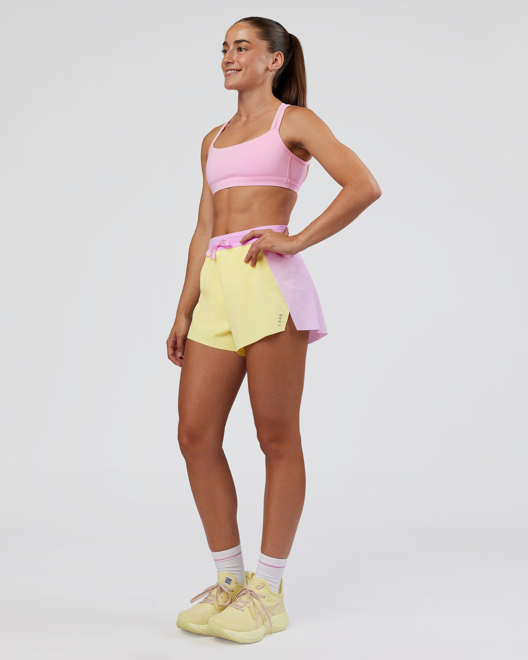 Woman wearing Accelerate 3" High-Rise Running Short - Marshmallow-Lemon | Model:Grace | Size:S