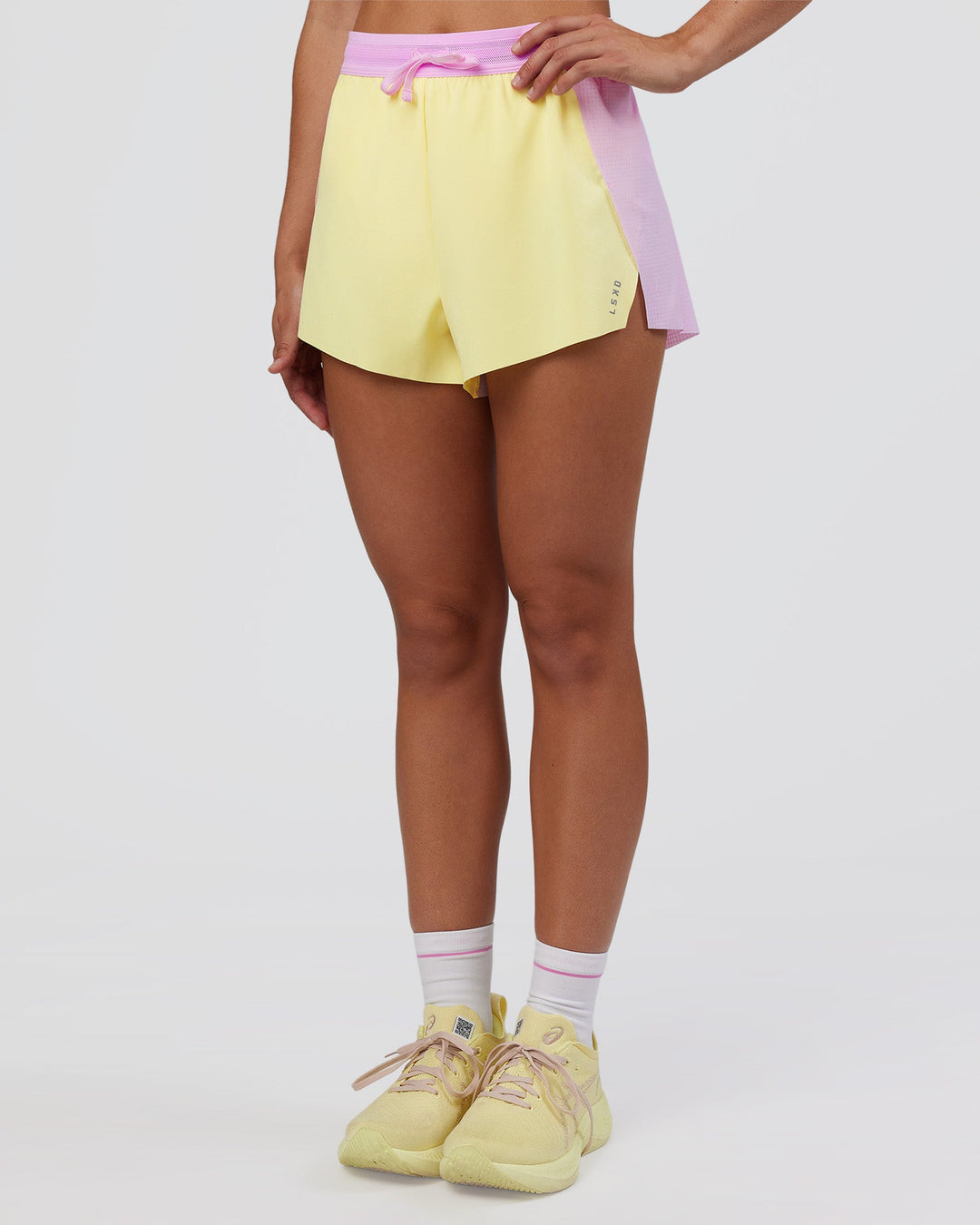 Woman wearing Accelerate 3" High-Rise Running Short - Marshmallow-Lemon | Model:Grace | Size:S