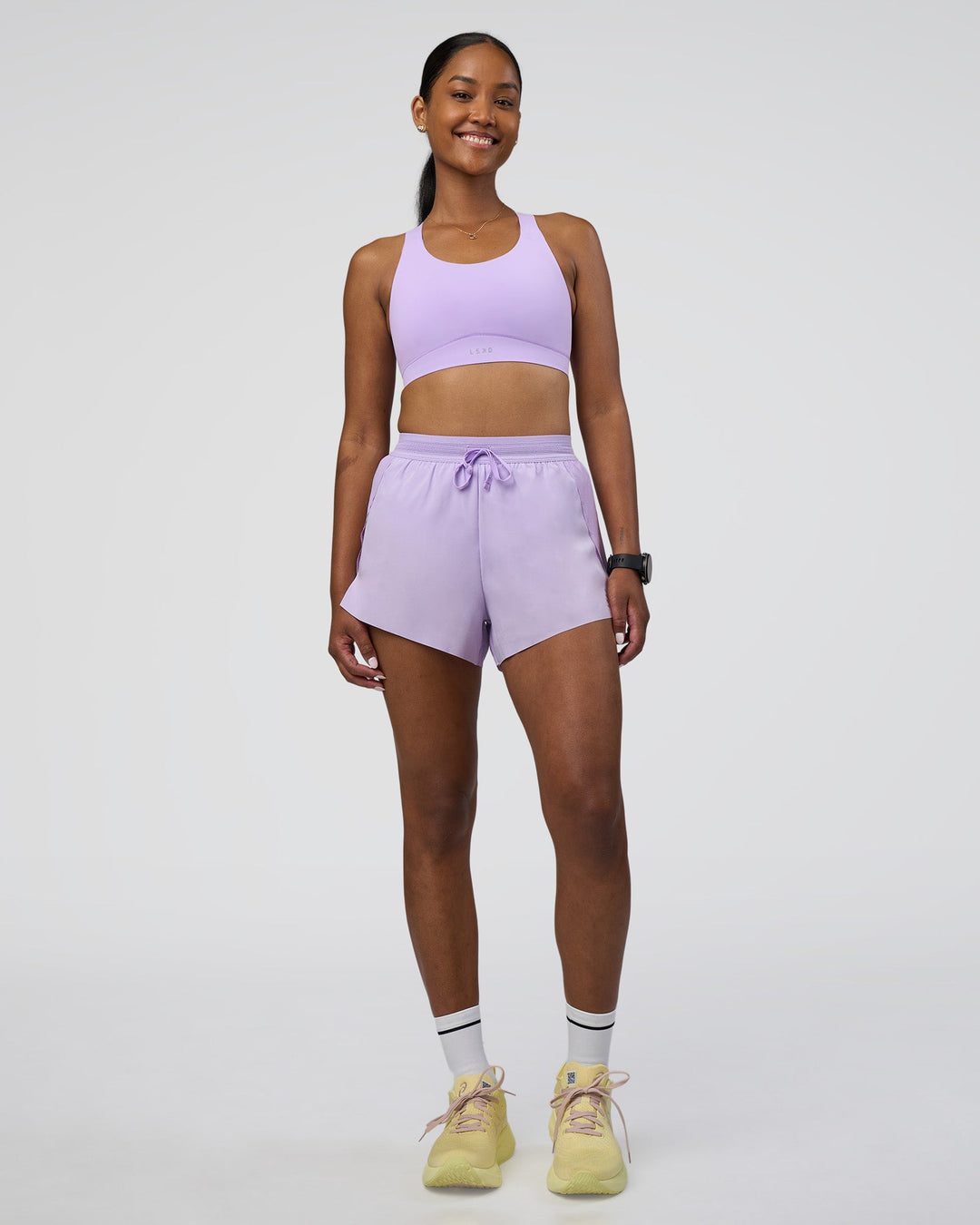 Woman wearing Accelerate 3&quot; High-Rise Running Short - Pale Lilac | Model:Rica | Size:S