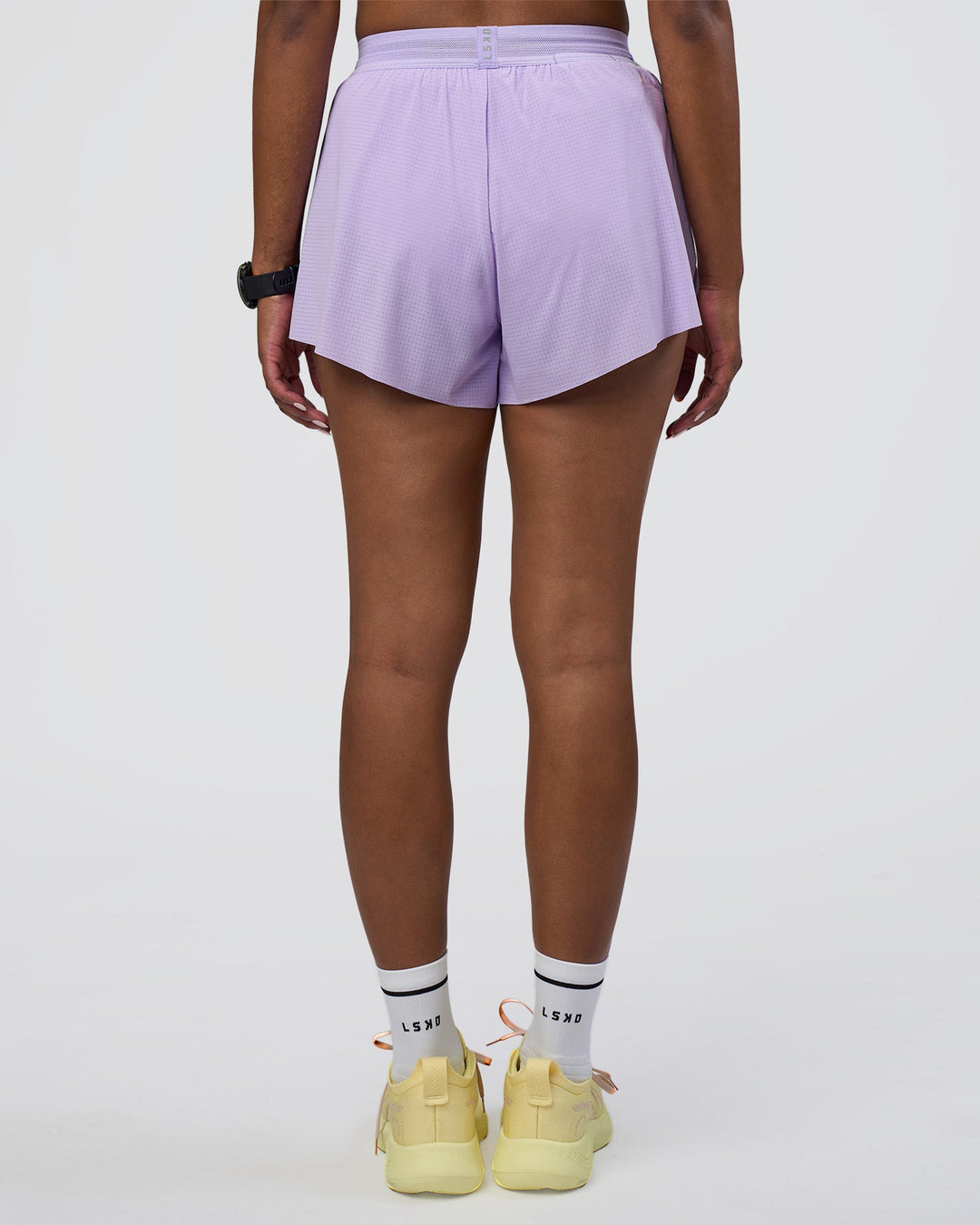 Woman wearing Accelerate 3&quot; High-Rise Running Short - Pale Lilac | Model:Rica | Size:S