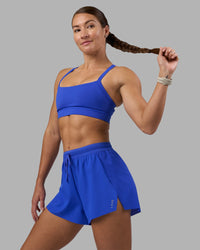 Woman wearing Accelerate 3" High-Rise Running Short - Power Cobalt | Model:Hannah | Size:S