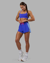 Woman wearing Accelerate 3" High-Rise Running Short - Power Cobalt-Open Air | Model:Hannah | Size:S