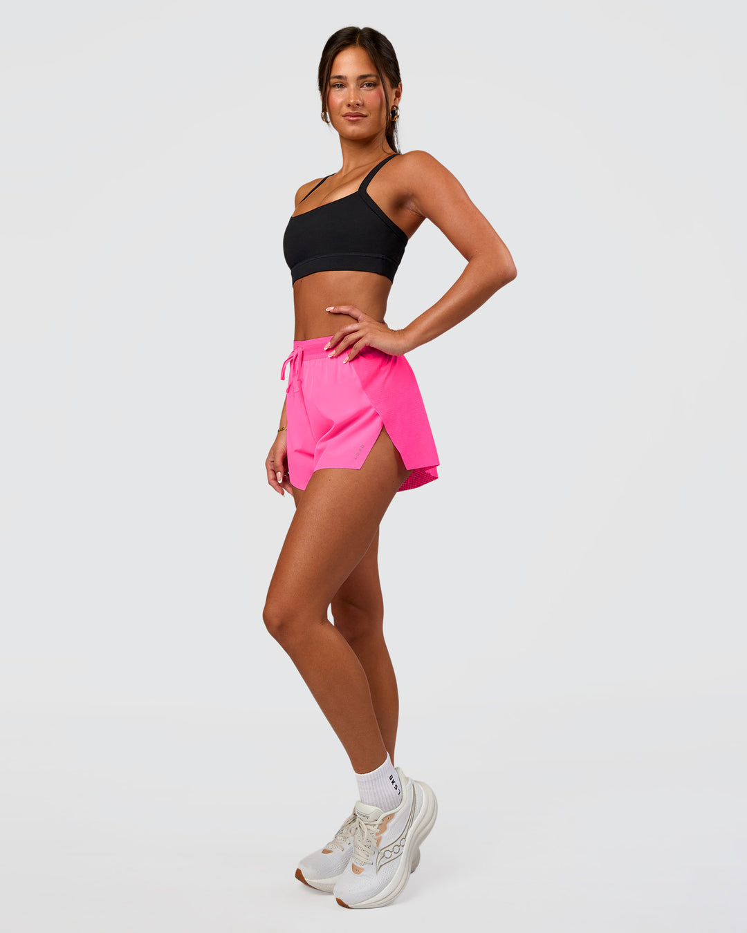 Woman wearing Accelerate 3" High-Rise Running Short - Sugar Plum | Set:true | Angle:side | Model:Bianca | Size:S
