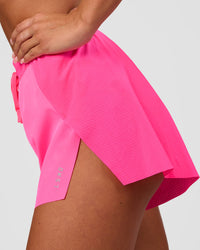 Woman wearing Accelerate 3" High-Rise Running Short - Sugar Plum | Set:true | Angle:side | Model:Bianca | Size:S