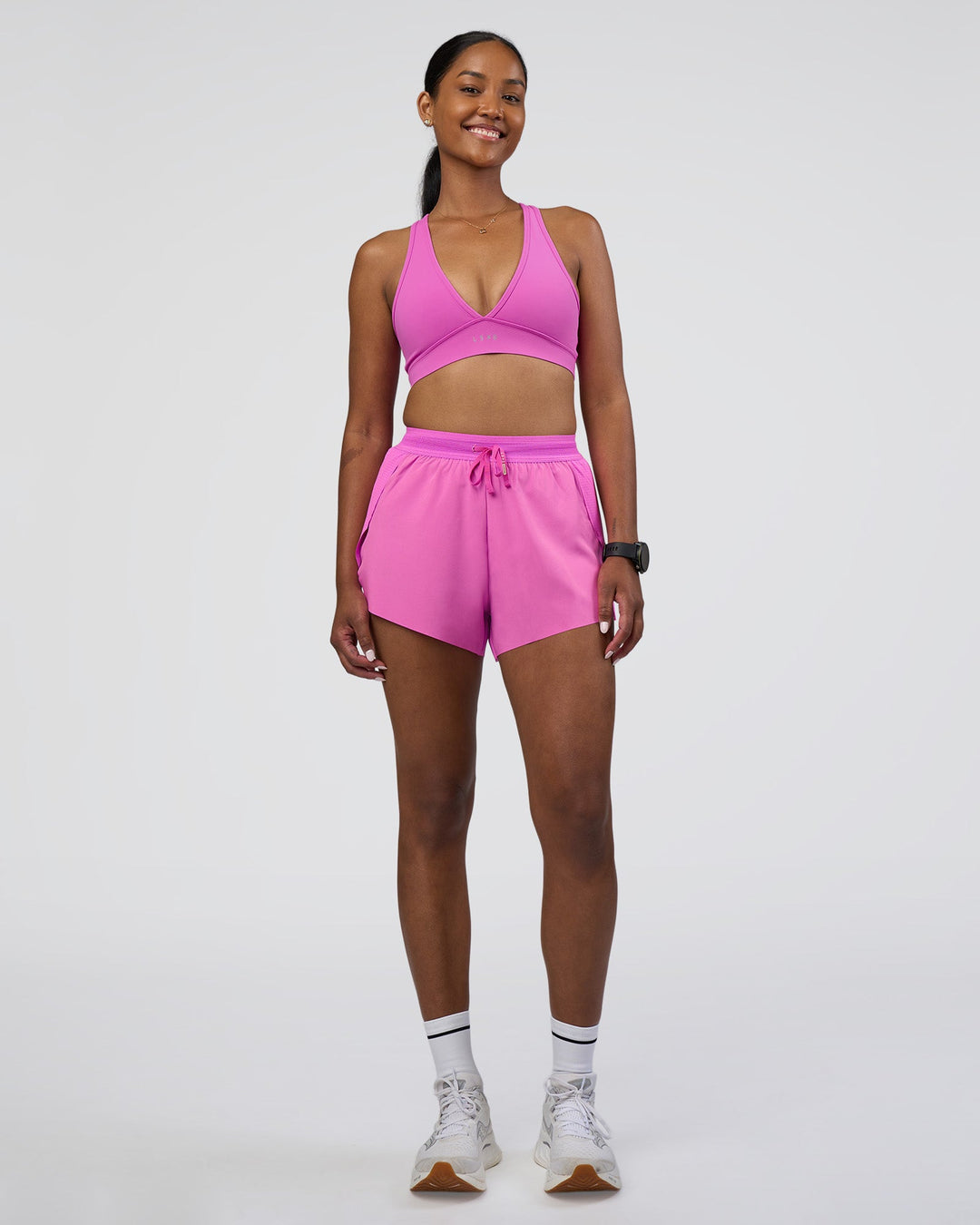 Woman wearing Accelerate 3" High-Rise Running Short - Ultra Fuchsia | Model:Rica | Size:S