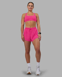 Woman wearing Accelerate 3" High-Rise Running Short - Ultra Pink | Model:Keisha | Size:S