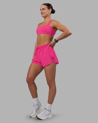 Woman wearing Accelerate 3" High-Rise Running Short - Ultra Pink | Model:Keisha | Size:S