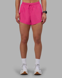 Woman wearing Accelerate 3" High-Rise Running Short - Ultra Pink | Set:true | Angle:front | Model:Keisha | Size:S