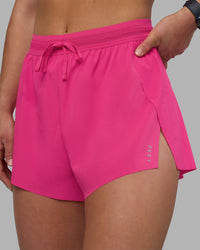 Woman wearing Accelerate 3" High-Rise Running Short - Ultra Pink | Set:true | Angle:closeup | Model:Keisha | Size:S