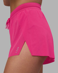 Woman wearing Accelerate 3" High-Rise Running Short - Ultra Pink | Model:Keisha | Size:S