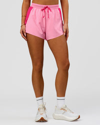 Woman wearing Accelerate 3" High-Rise Running Short - Ultra Pink-Candy Pink | Model:Bianca | Size:S