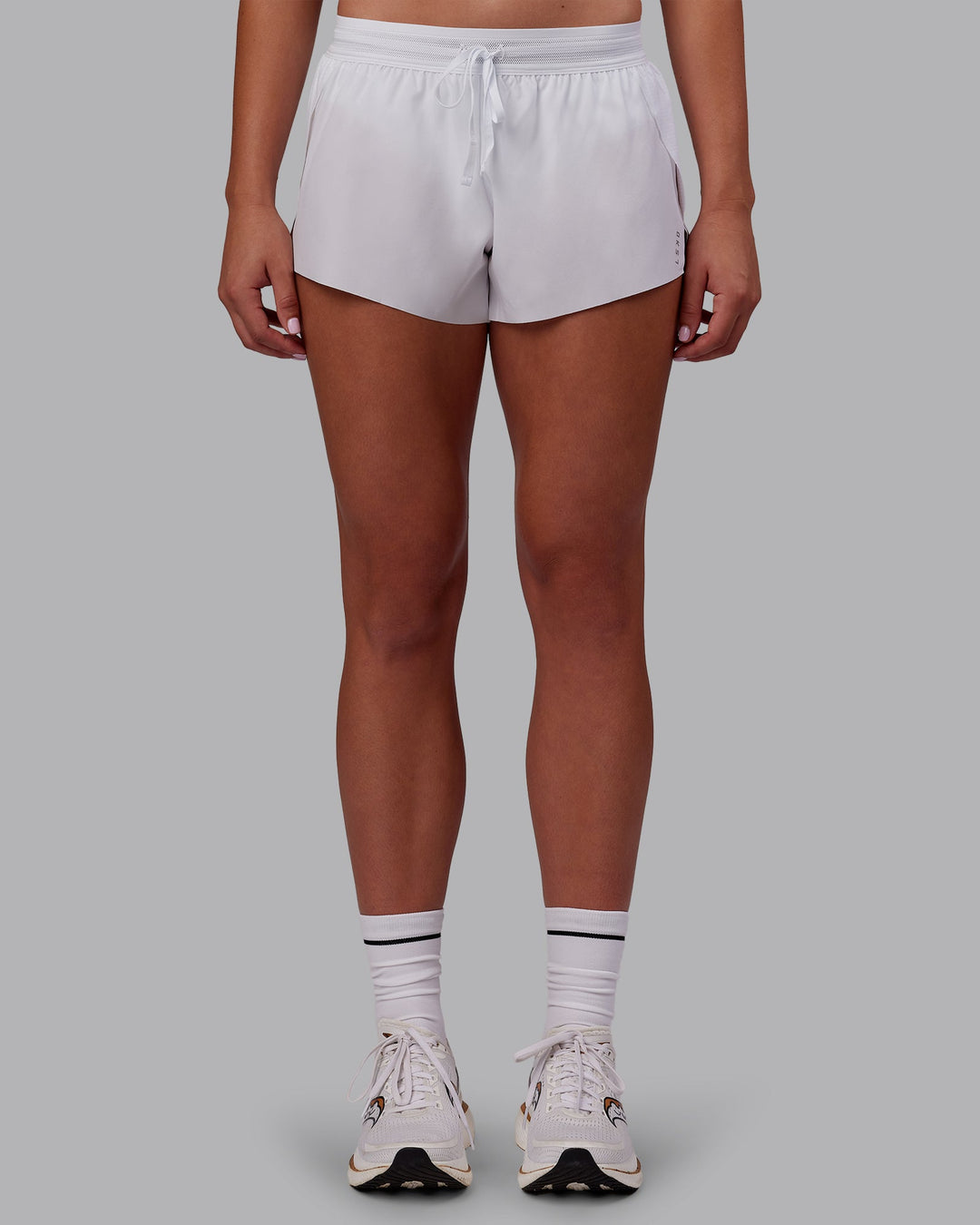 Woman wearing Accelerate 3&quot; Running Short - White | Model:Charlize | Size:S