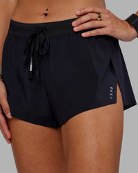 Woman wearing Accelerate 3" Running Short - Black | Set:true | Angle:closeup | Model:Vanessa | Size:S