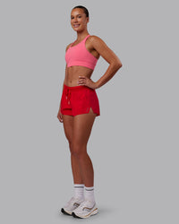 Woman wearing Accelerate Run Shorts - Scarlet | Model:Charlize | Size:S
