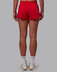 Woman wearing Accelerate Run Shorts - Scarlet | Model:Charlize | Size:S