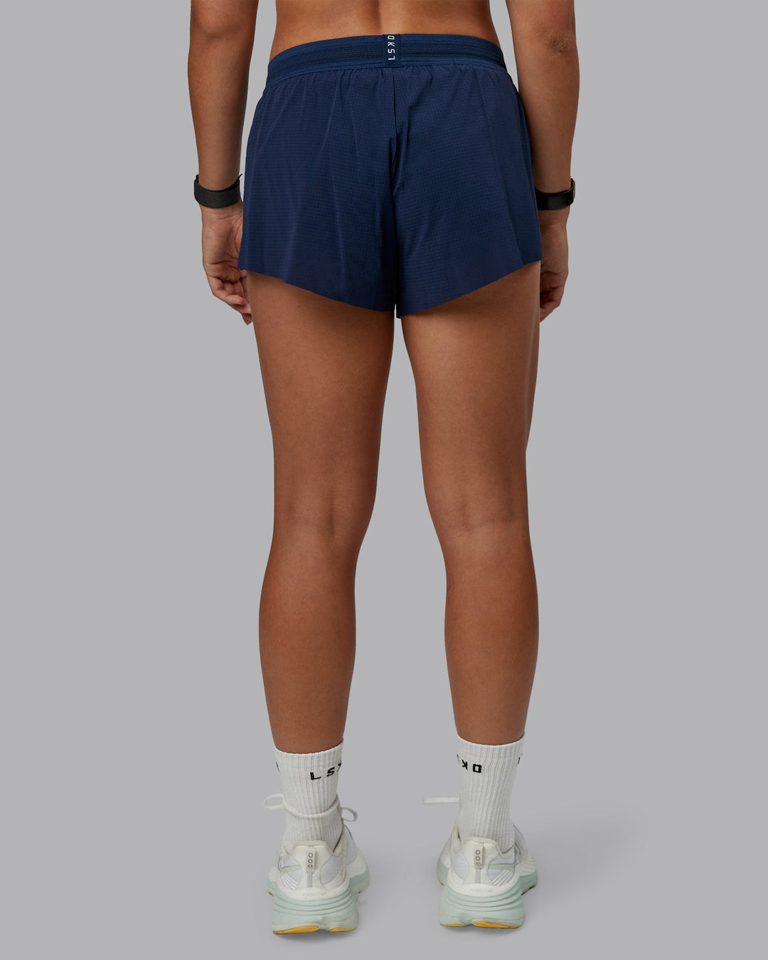 Woman wearing Accelerate Run Short 3&quot; in Future Navy | Size:S