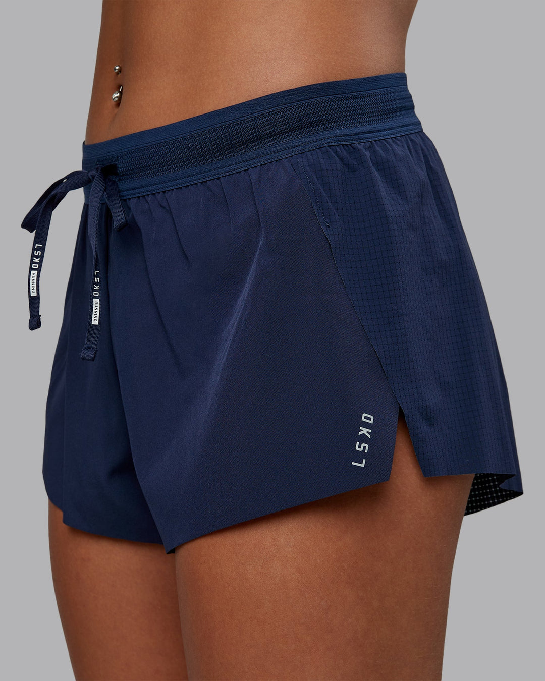 Woman wearing Accelerate Run Short 3&quot; in Future Navy | Size:S