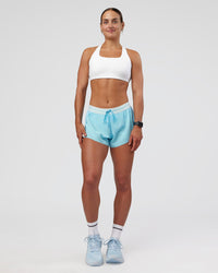 Woman wearing Accelerate 3" Mid-Rise Running Short - Baltic Sea-Off White | Model:Keisha | Size:S | Thumbnail Index: 2