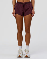 Woman wearing Accelerate 3" Mid-Rise Running Short - Cherry Lacquer-| Model:Bianca| Size:S |
