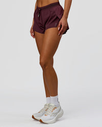 Woman wearing Accelerate 3" Mid-Rise Running Short - Cherry Lacquer-| Model:Bianca| Size:S |
