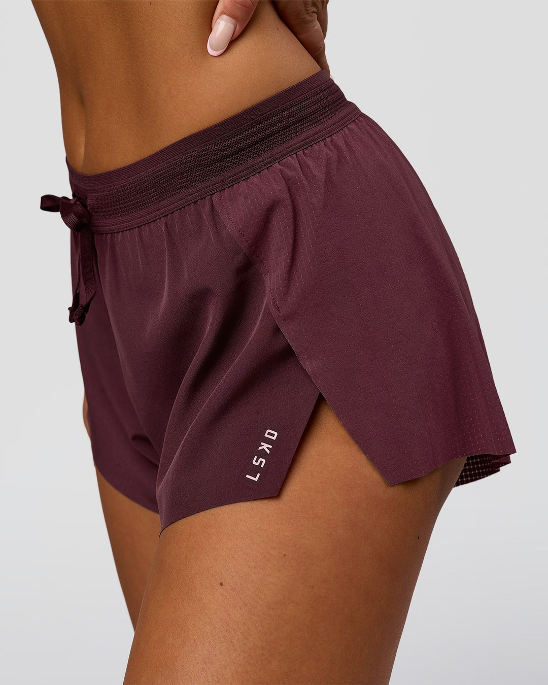 Woman wearing Accelerate 3" Mid-Rise Running Short - Cherry Lacquer-| Model:Bianca | Size:S |