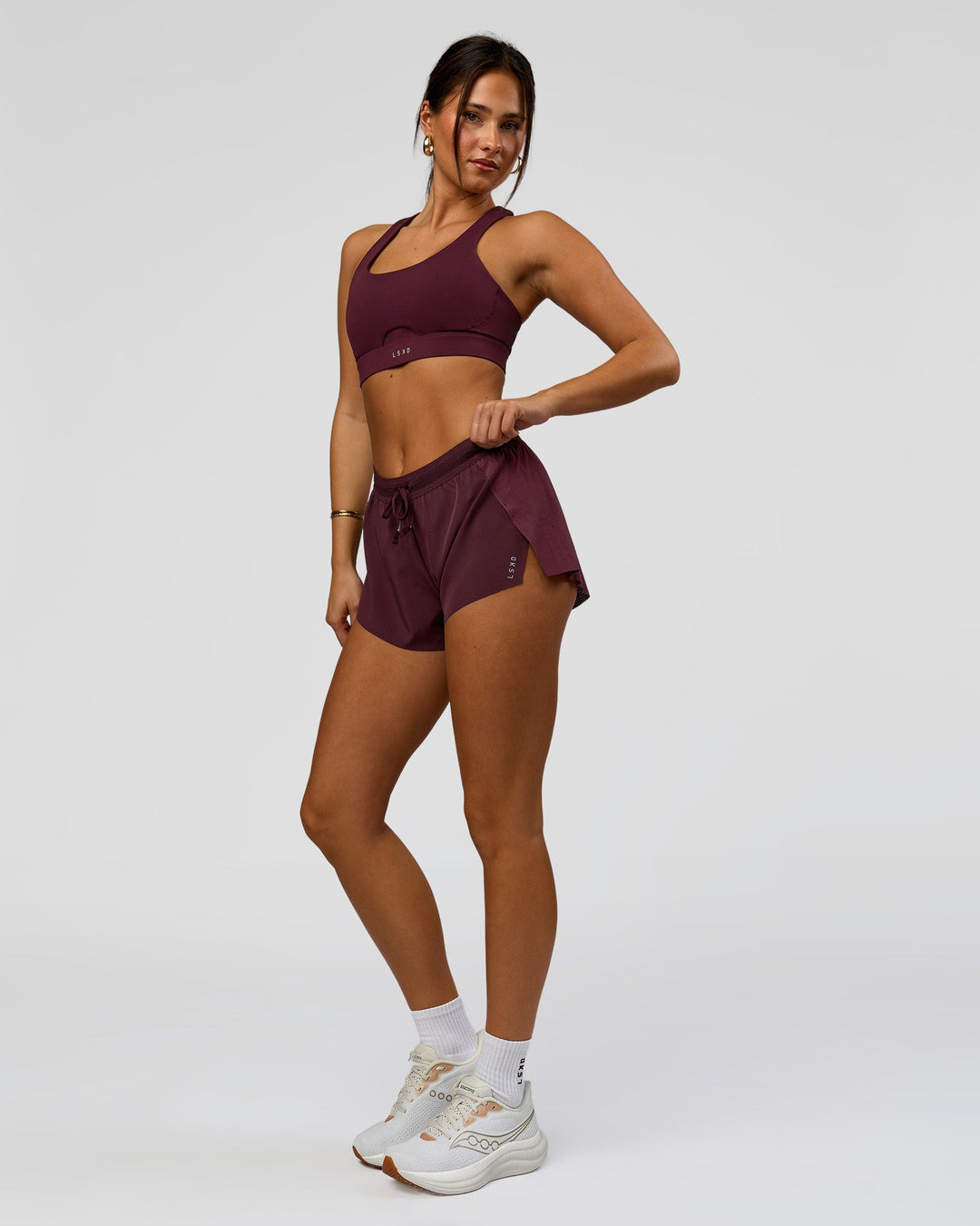 Woman wearing Accelerate 3" Mid-Rise Running Short - Cherry Lacquer-| Model:Bianca | Size:S |